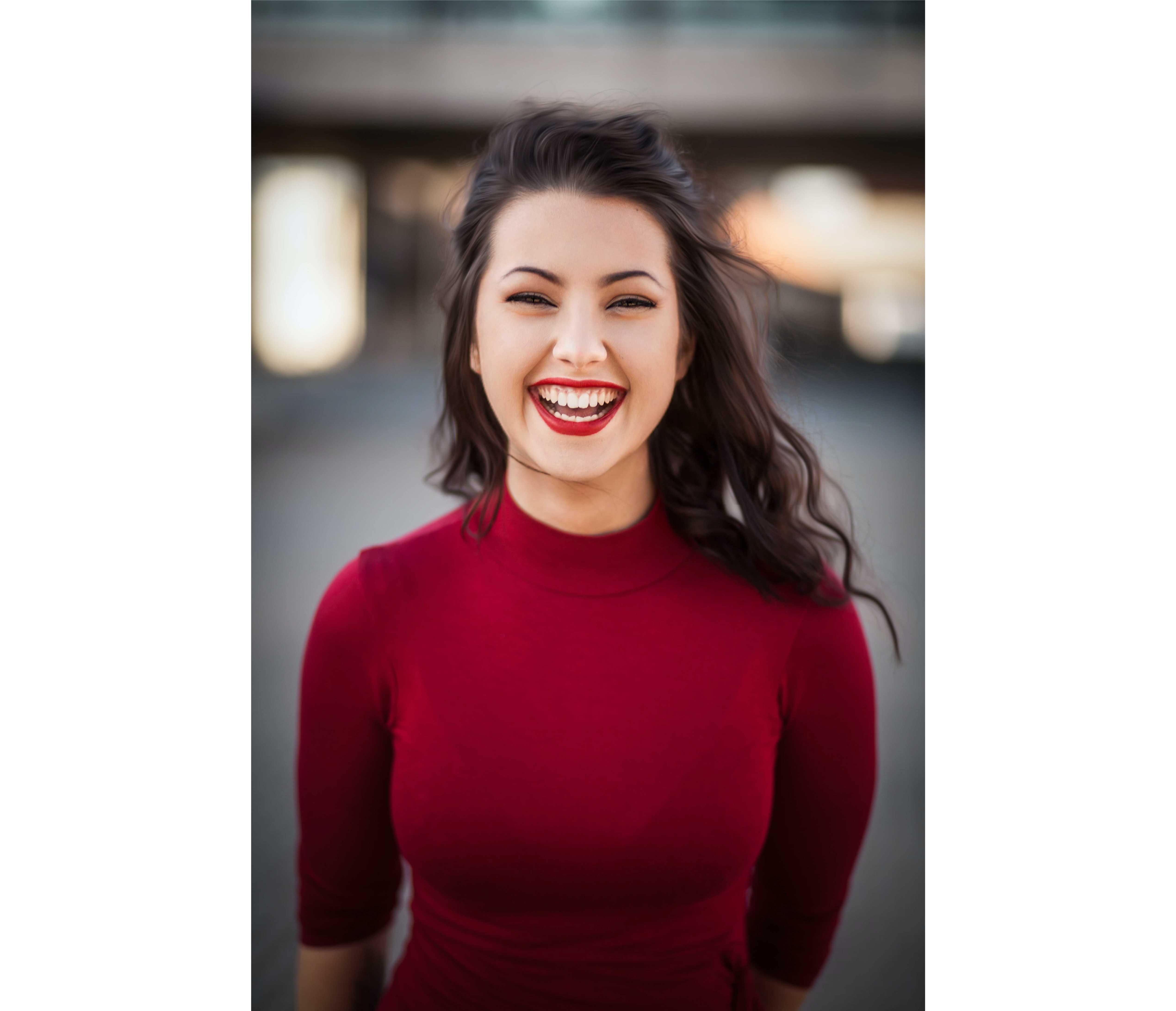 Happy smiling woman in red. 