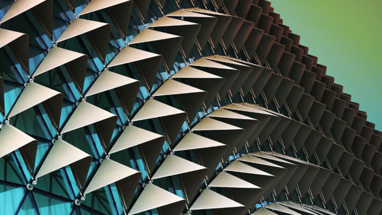 Abstract close-up view of modern aluminium ventilated facade of triangles.